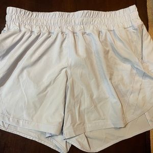 Purple/white lululemon track that mid-rise lined shorts size 12